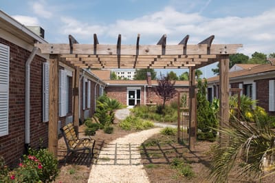 Pathway leading through a landscaped outdoor space