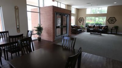 Bright common area with seating and natural light