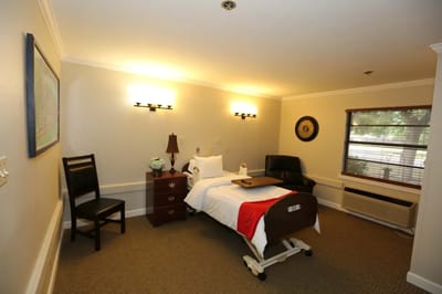 Cozy resident room with bed and seating area