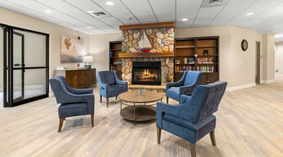 Cozy common area with seating and a fireplace