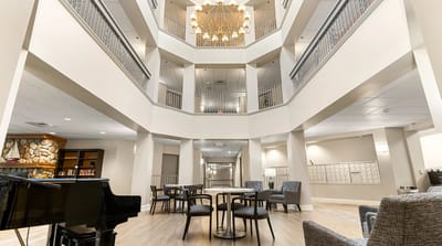 Bright interior common area with seating and chandelier