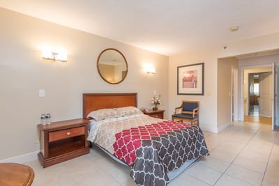 Cozy private resident room with bed and seating area