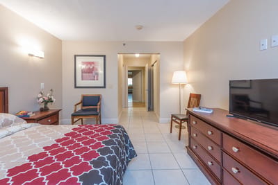 Cozy interior of a resident room with a bed and furniture