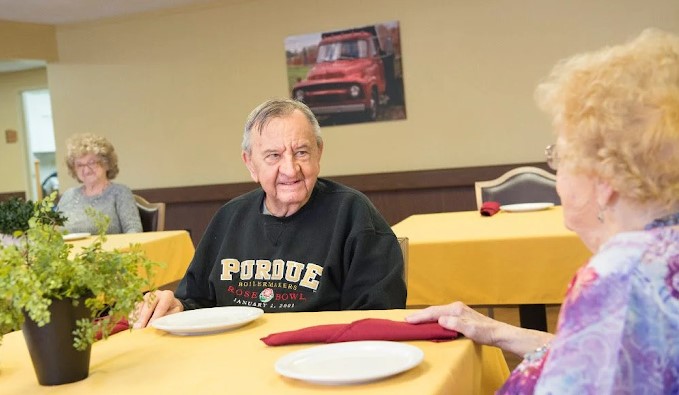 Residents enjoying a meal in the dining room