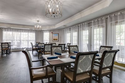 Dining room with tables and chairs set for meals