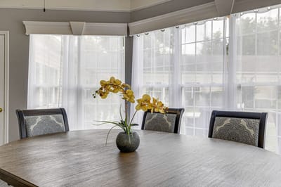 Decorative dining area with flower centerpiece