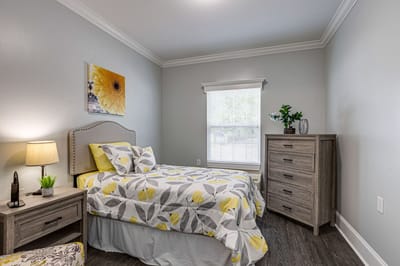 Cozy private room with floral bedding and natural light