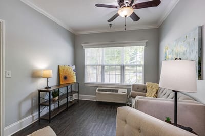 Bright common area with comfortable seating and natural light