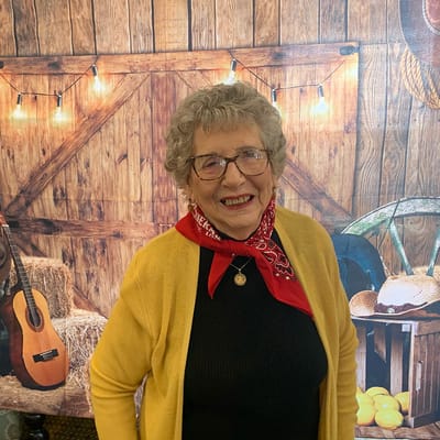 Resident smiling with decorative background