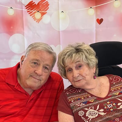 Residents smiling together at a festive gathering