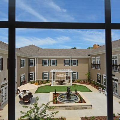 View of a serene courtyard with a fountain and seating