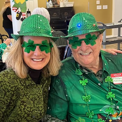 Residents celebrating in festive attire during an event
