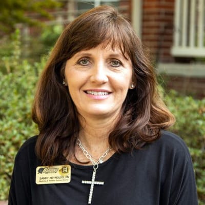 Director of nursing posing outdoors