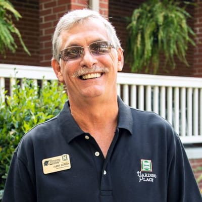 Staff member smiling outside the facility