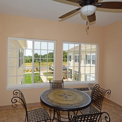 Sunroom with a dining table and view of the outdoors