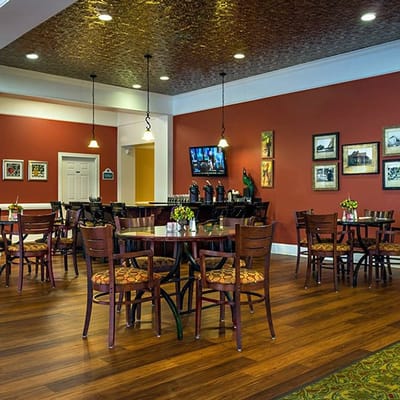Interior dining area with wooden tables and chairs