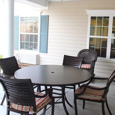 Outdoor seating area with a round table and chairs