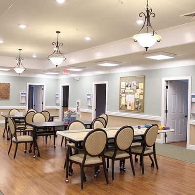 Bright activity room with tables and chairs