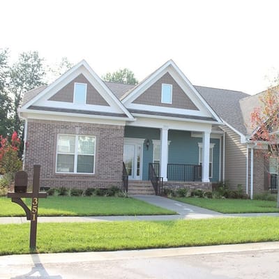 Exterior view of a single-story building in a serene setting