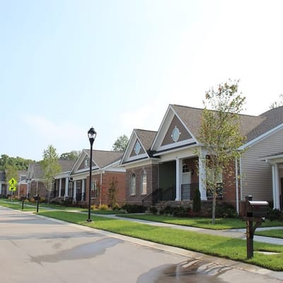 Row of single-story cottages in a quiet neighborhood