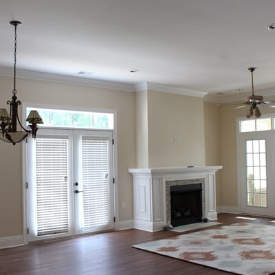 Bright common area with a fireplace and windows
