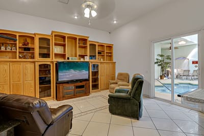 Bright common area with comfortable seating and a TV