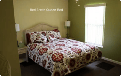 Cozy bedroom with a queen bed and decorative bedding