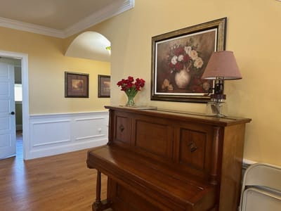 Interior view of a common area with a piano