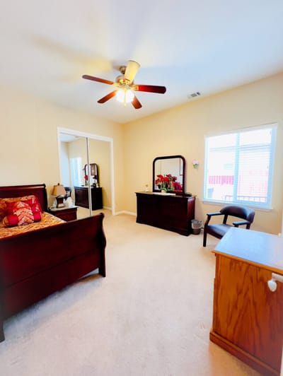 Cozy private room with a bed and dresser