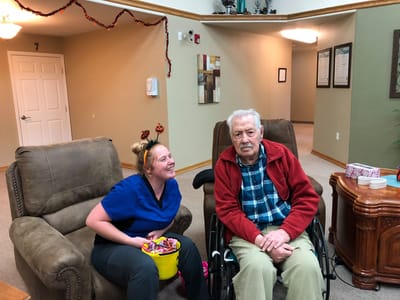 Staff member interacting with a resident in a common area