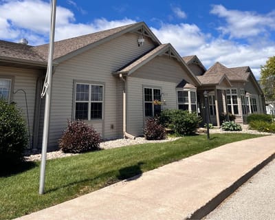 Exterior view of the assisted living facility with landscaping