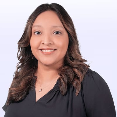 Portrait of a staff member smiling in a professional setting