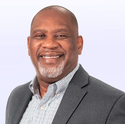 Professional headshot of a man smiling