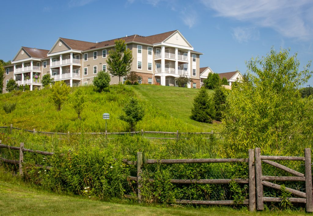Exterior view of Conifer Village at Ithaca on a sunny day