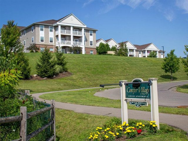 Exterior view of Conifer Village building and sign