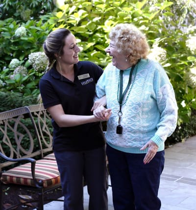 Caregiver and resident enjoying a moment outdoors