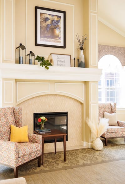 Cozy common area with fireplace and chairs