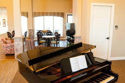 Interior view of a common area with a piano