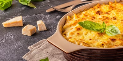 Delicious baked pasta served with basil