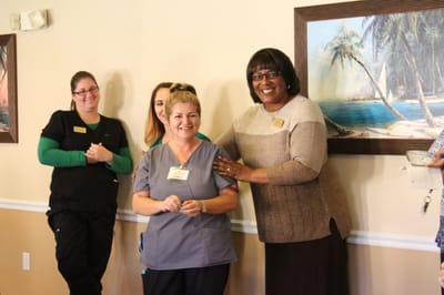 Staff members celebrating in a lively common area
