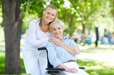 A caregiver and resident enjoying time outdoors