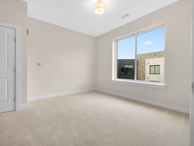 Bright empty resident room with a window view
