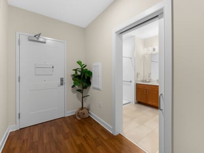Interior view of a resident room entrance with bathroom