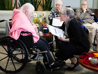 Staff engaging with residents in a common area