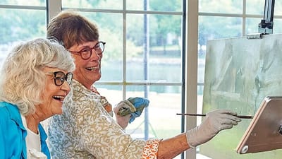 Residents enjoying a painting activity together