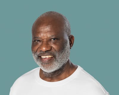 Smiling senior man in a plain shirt