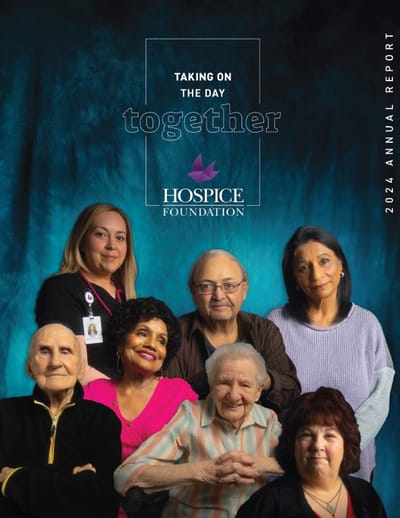 Residents and staff posing together for a photo