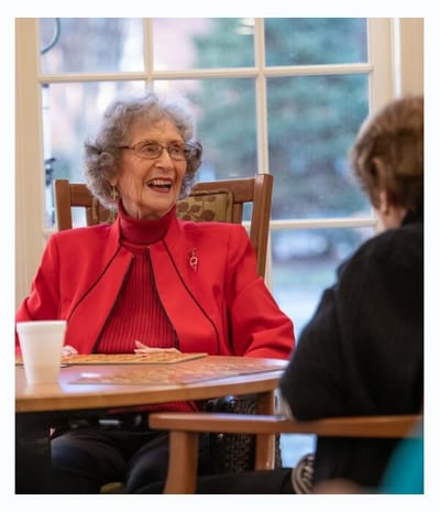 Residents enjoying a conversation in a common area