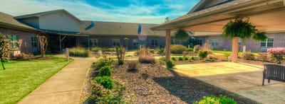 Timberlane Health & Rehab, assisted living in El Dorado, AR — Scenic garden area with walking paths and seating