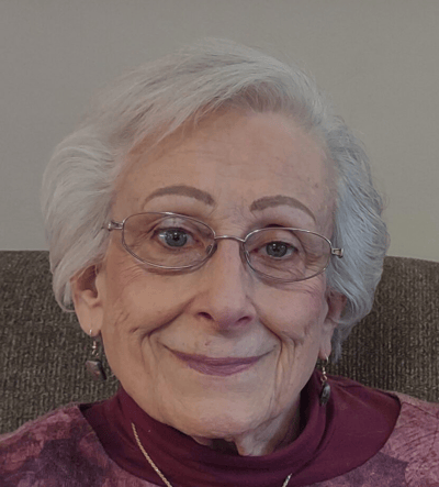 Close-up portrait of an elderly woman smiling